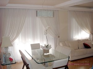 white-modern-curtains-in-light-living-room-interior